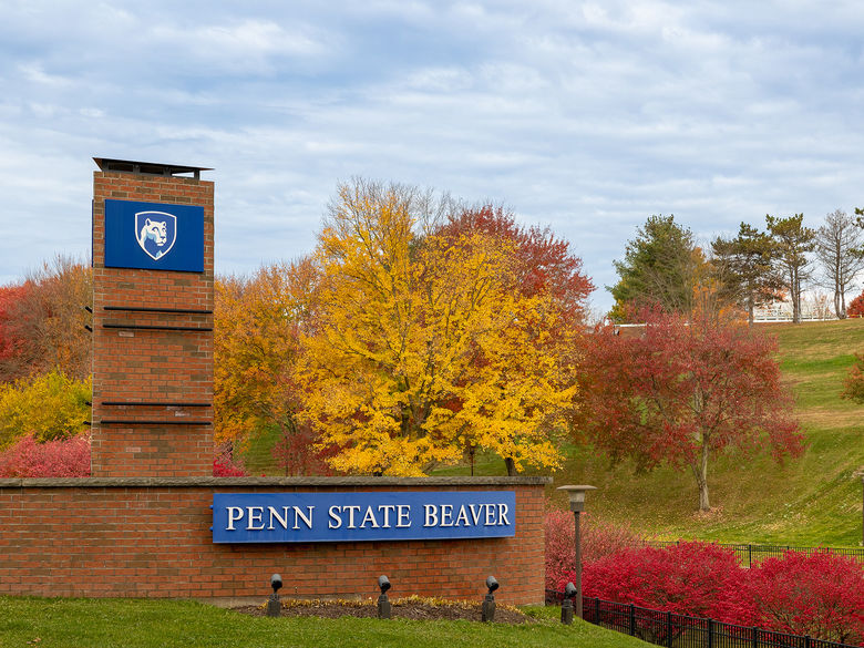 Penn State Beaver entrance sign with fall trees in the background.